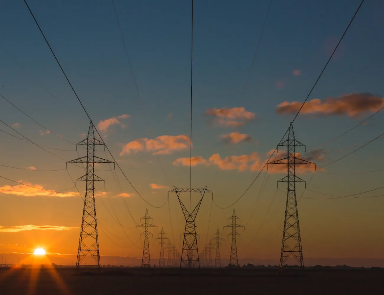 Electricity transmission towers at dusk